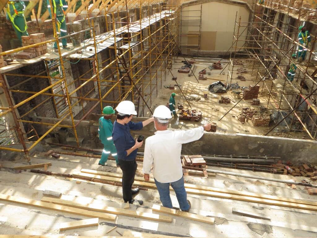 3 workers on a construction site managing the job.